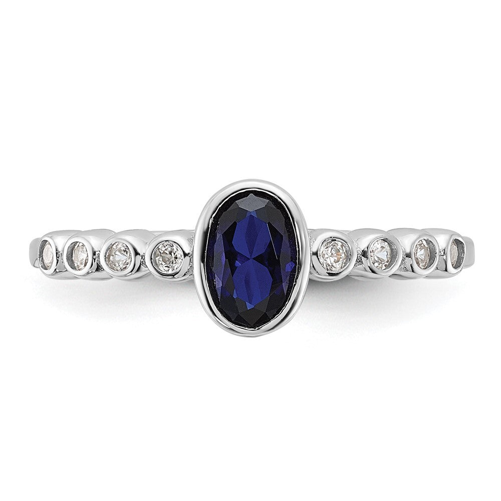 SS Rh-plated .01Created White Sapphire .56Created Blue Spinel Ring Size 6