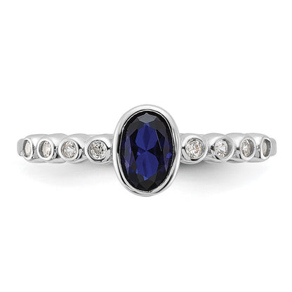 SS Rh-plated .01Created White Sapphire .56Created Blue Spinel Ring Size 6