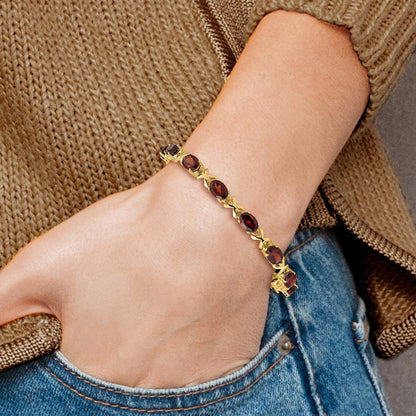 14k Complete 7x5mm Oval Garnet X-design 7 inch Bracelet