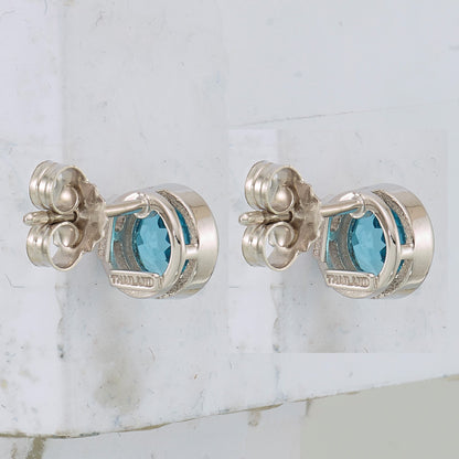 Sterling Silver Rhodium-plated Blue Topaz Circle Stud Earrings