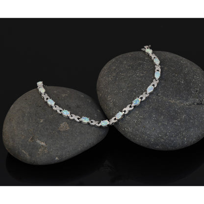 Sterling Silver Rhodium Plated 7.5inch Created Opal XO Bracelet