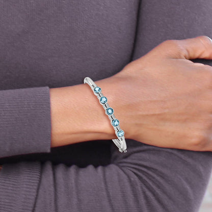 Sterling Silver Rhodium-plated Light Swiss Blue Topaz Hinged Bangle