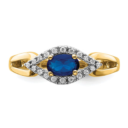 14k East-West 6x4mm Oval Blue Sapphire and 1/8 carat Diamond Ring