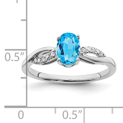 14k White Gold 7x5mm Oval Blue Topaz and 1/20 carat Diamond Ring