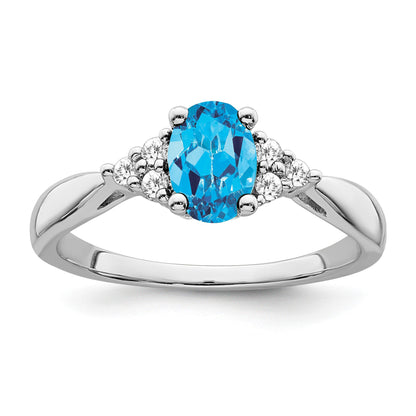 14k White Gold 7x5 Oval Blue Topaz and 1/8 carat Diamond Ring
