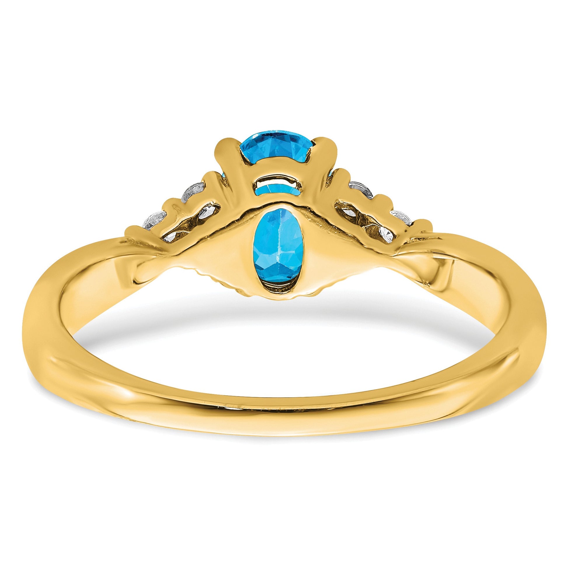 14k 7x5 Oval Blue Topaz and 1/8 carat Diamond Ring