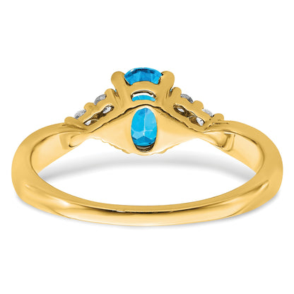 14k 7x5 Oval Blue Topaz and 1/8 carat Diamond Ring