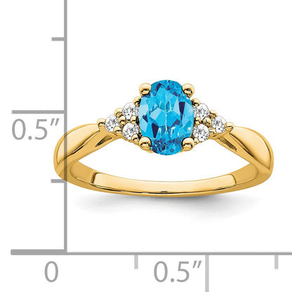 14k 7x5 Oval Blue Topaz and 1/8 carat Diamond Ring