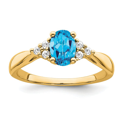 14k 7x5 Oval Blue Topaz and 1/8 carat Diamond Ring