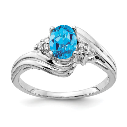 14k White Gold 7x5mm Oval Blue Topaz and 1/15 carat AA Diamond Ring