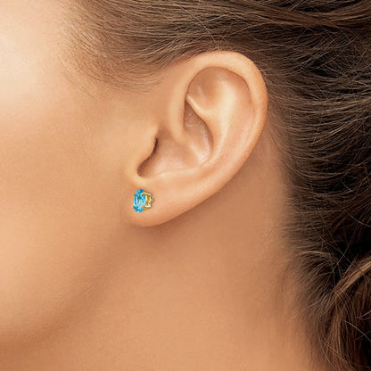 14k Yellow Gold 7x5mm Oval Blue Topaz Stud Earrings