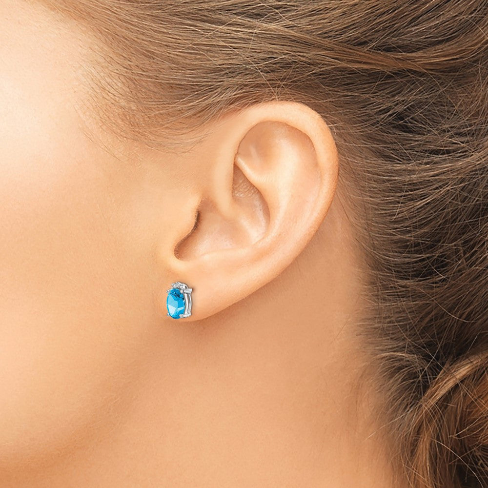 Sterling Silver Rhodium Plated Oval Blue Topaz and Diamond Button Stud Earrings
