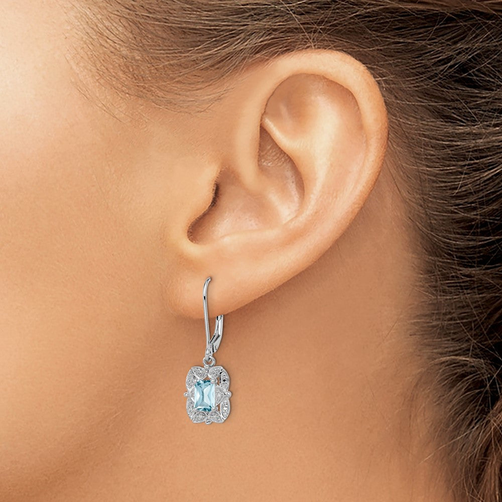 Sterling Silver Rhodium-plated Diamond and Blue Topaz Dangle Earrings